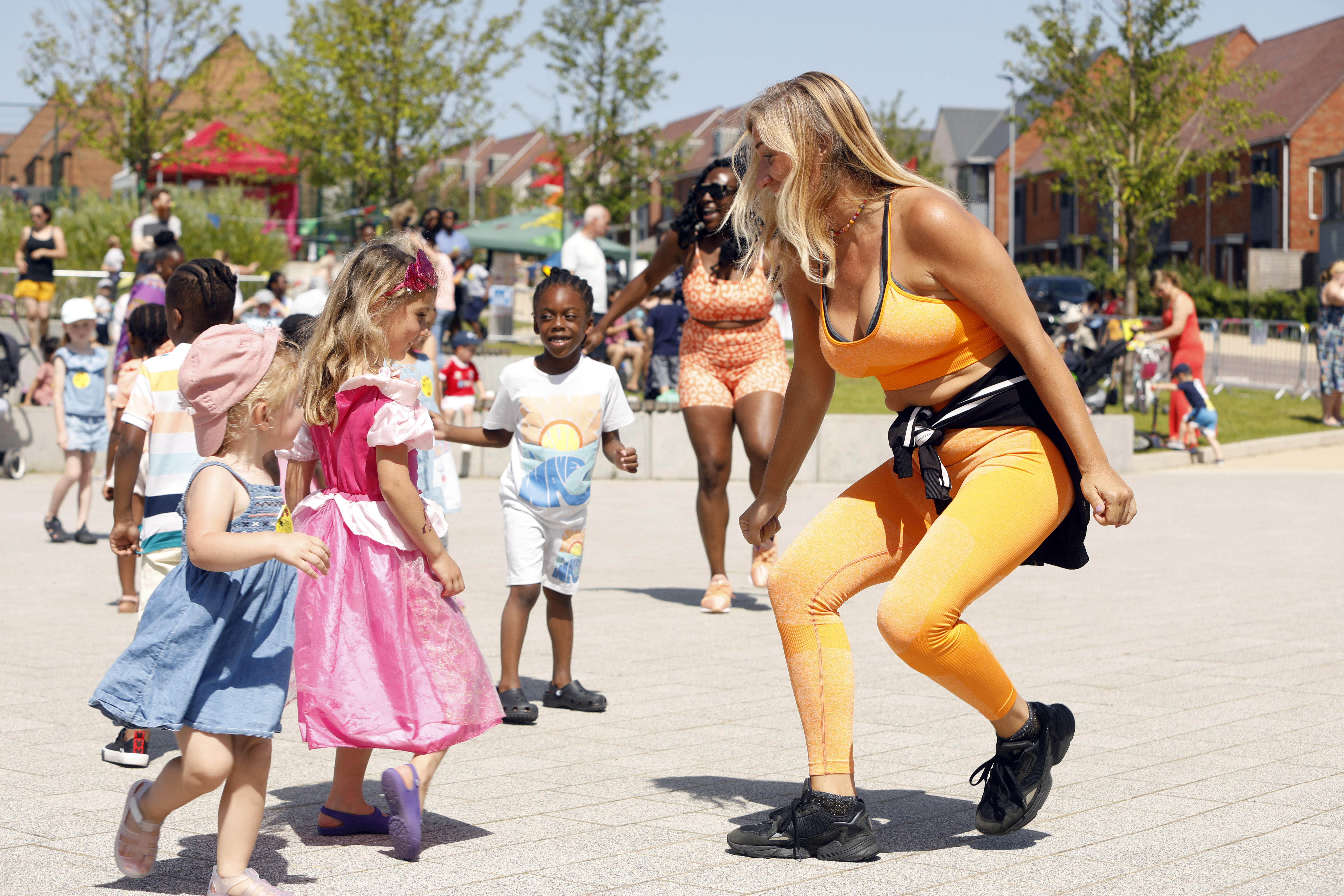 Image of woman dancing with children
