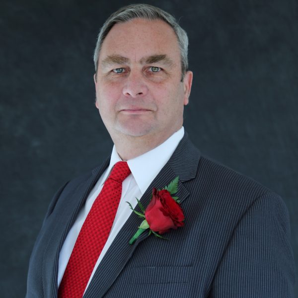 Image of Labour leader for Gravesham in grey suit and red tie